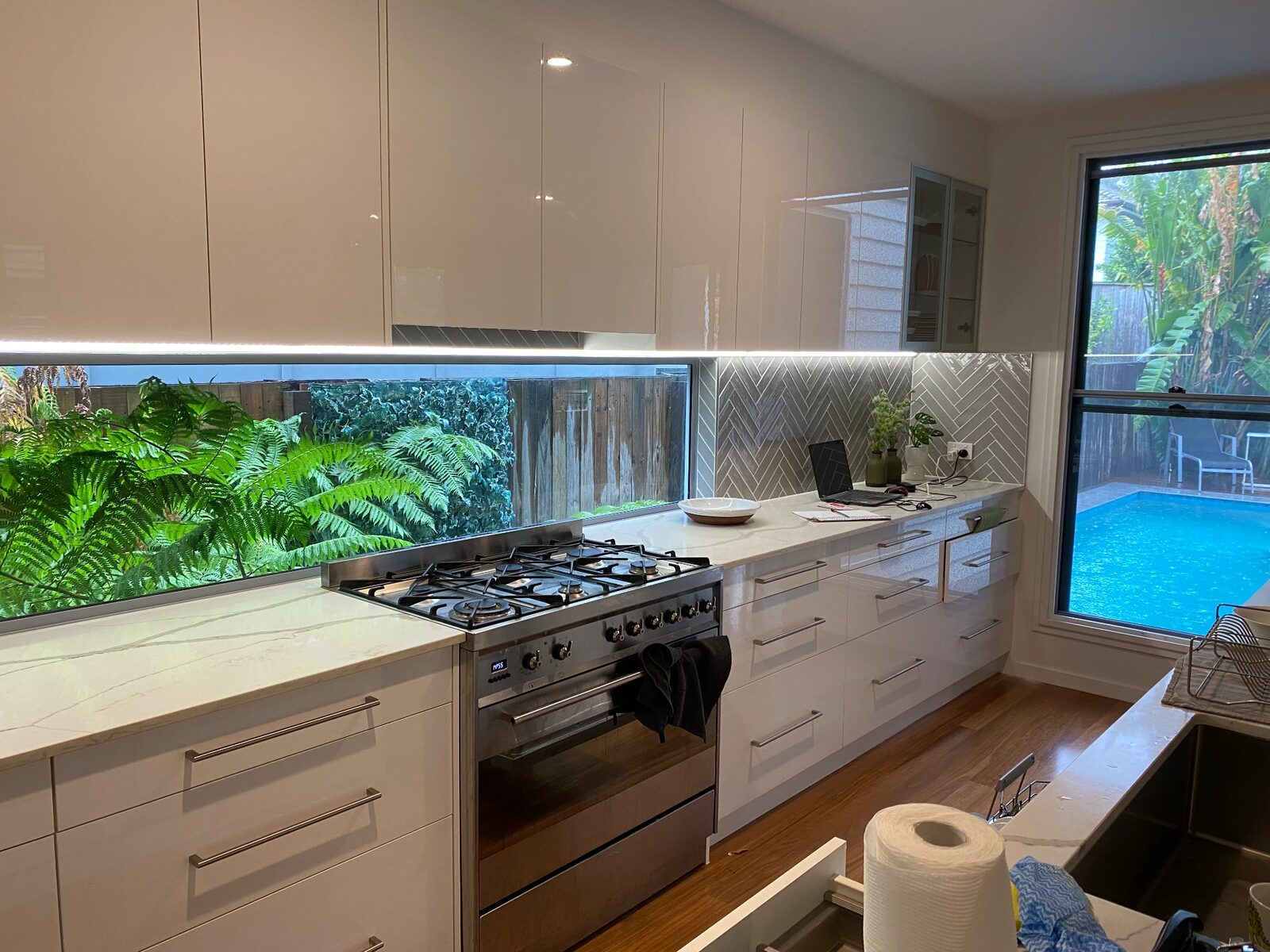 Kitchen with LED strip lighting under the overhead cabinets installed by KBR Electrical